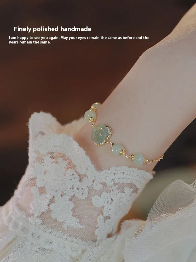 Hetian jade women's bracelet with rose flower design and 14K gold gilding details