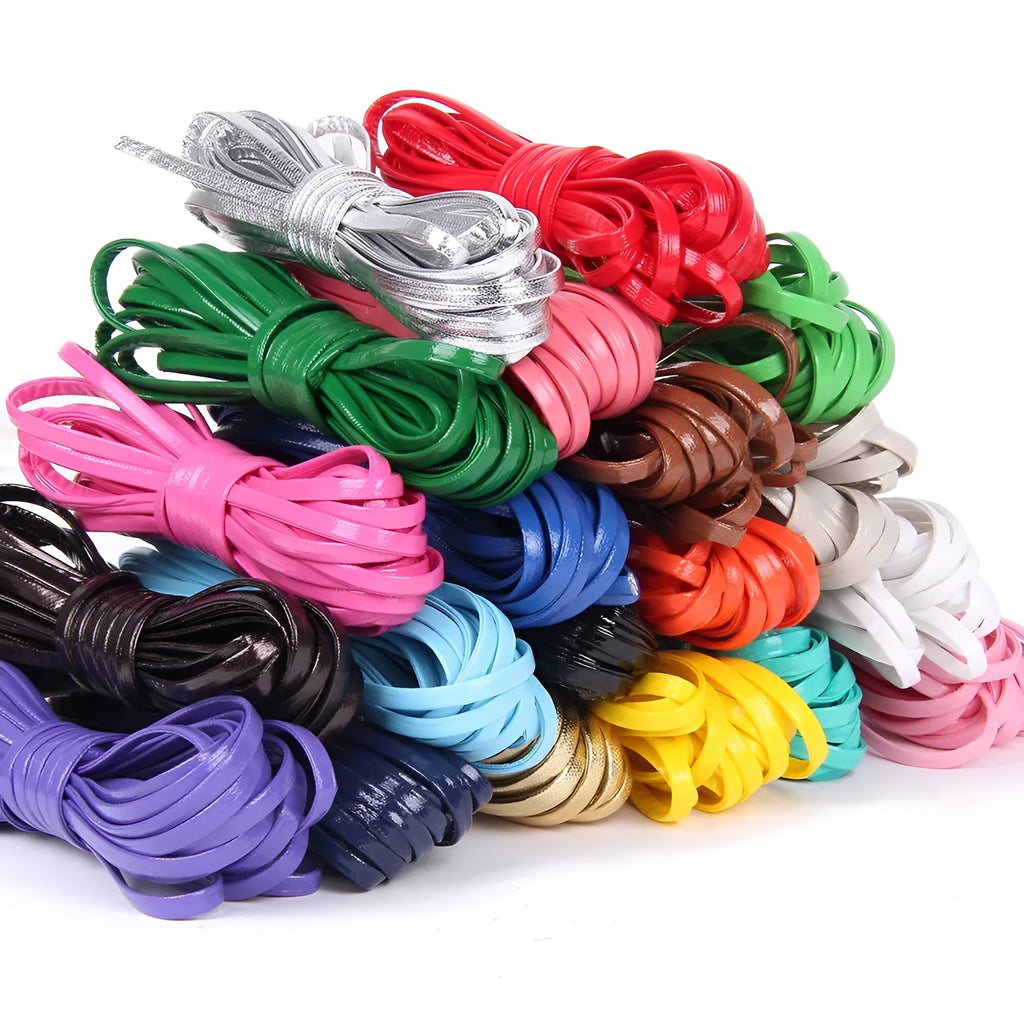 Spool of soft beige PU leather woven cord for DIY crafts and jewellery making.