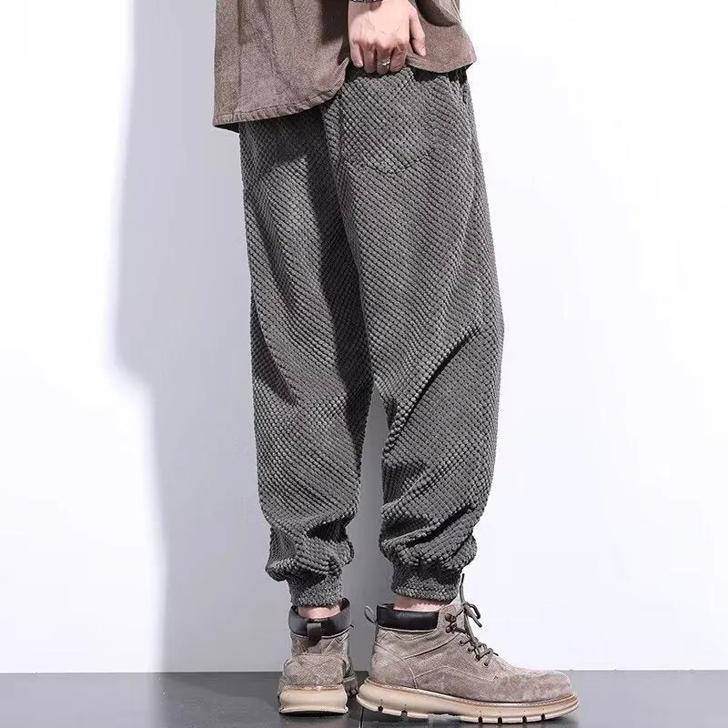 Men's grey ankle-tie casual sweatpants with straight leg design on hanger