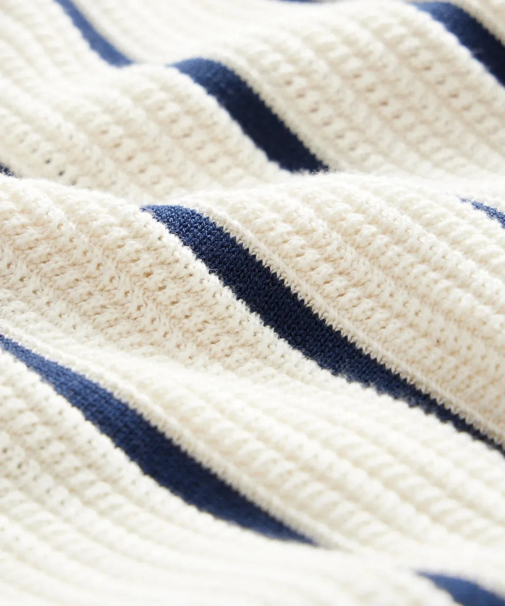 Men's white British style asymmetrical lapel knitted top with short sleeves and stripe pattern