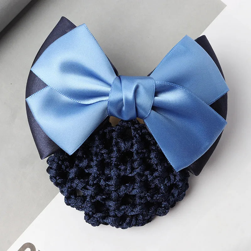 Professional hair clip with a black net pocket and a red flower bow ornament on a white background.