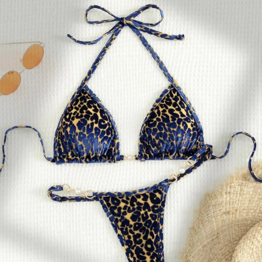 Women's leopard print swimsuit bikini in blue on yellow background
