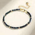 Women's blue tourmaline bracelet with 3mm beads and gold spacer beads