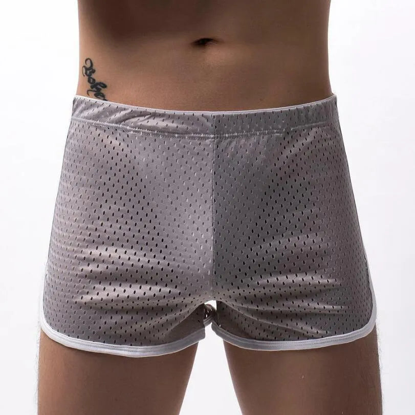 Men's cotton three-point boxer shorts in light blue on a grey background
