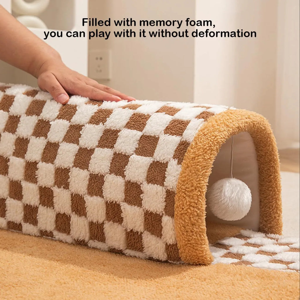 XL coffee coloured plush fan-shaped pet bed with a tunnel for dogs and cats on a wooden floor.