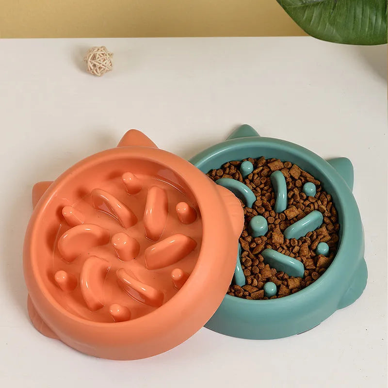 Green pet slow feeder bowl with bone-shaped raised ridges