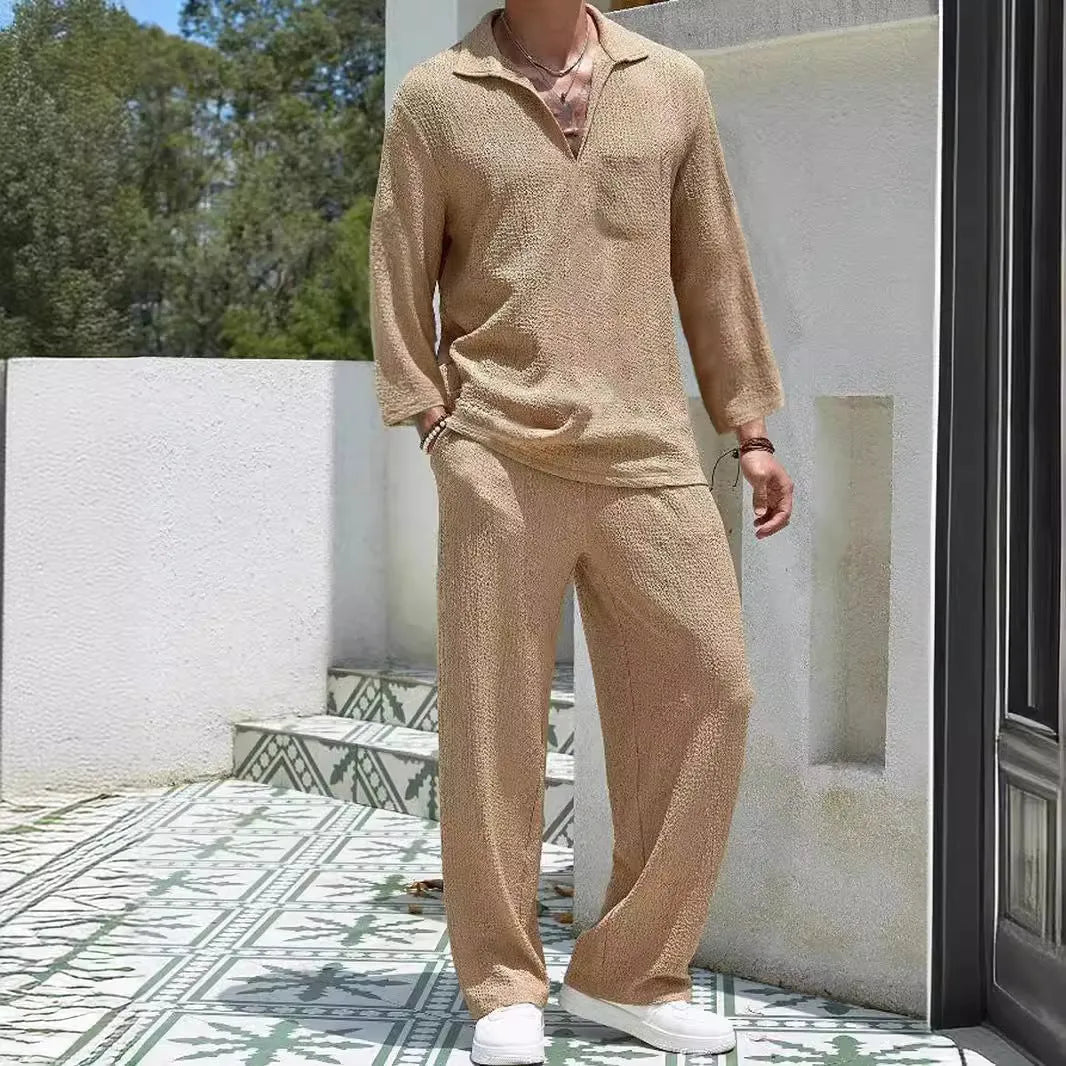 Man wearing a lake blue casual shirt and matching trousers from a polyester suit set.