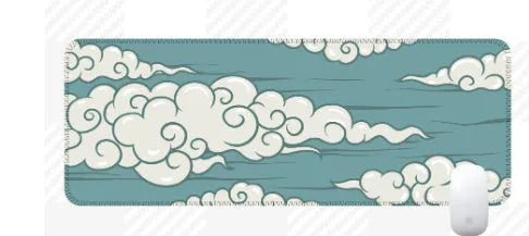 Large rectangular cloud pattern desk mat made of natural rubber on a wooden desk.