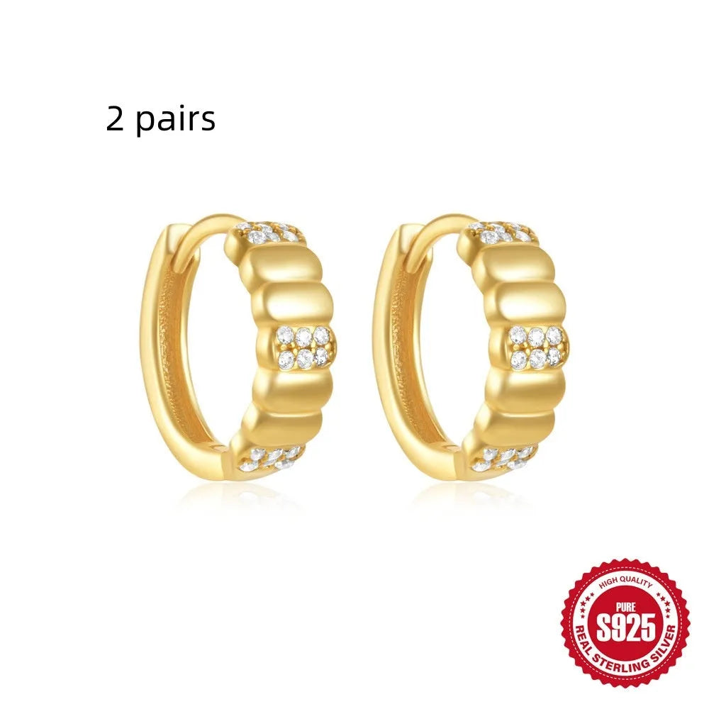 Sterling silver geometric stud earrings with diamond detailing in gold or silver finish