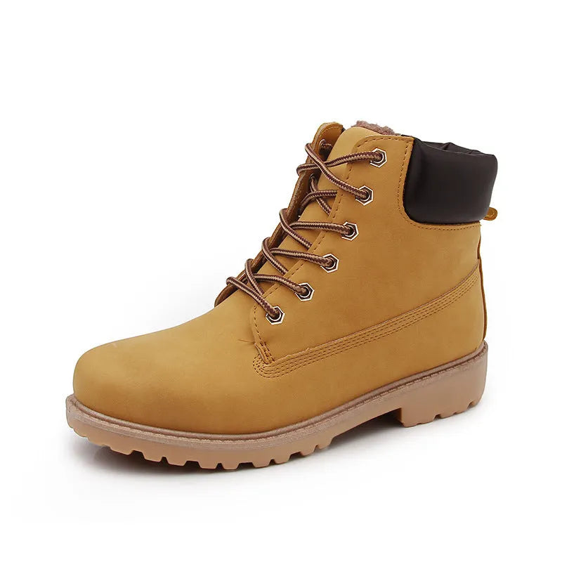 Men's pink high-top Martin boots with front lace-up and a low flat heel on a neutral background.