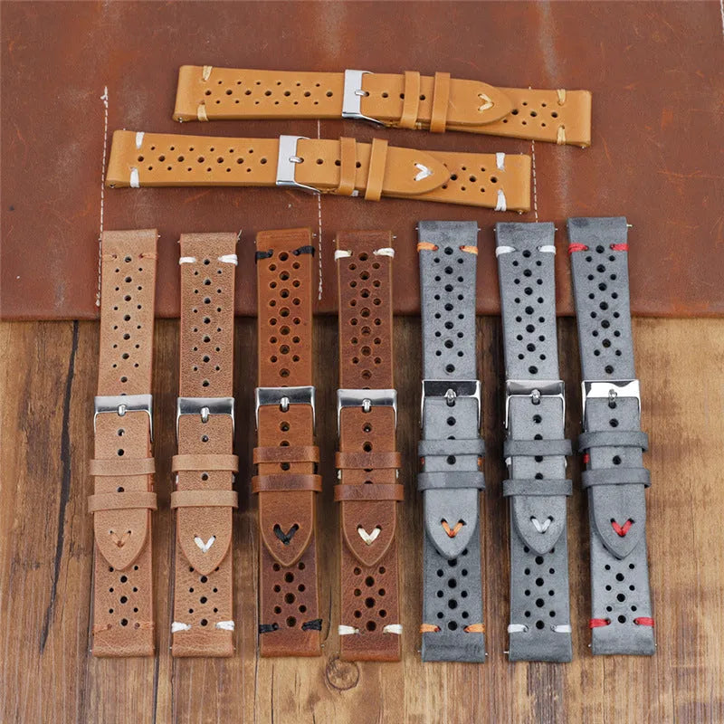 Handmade retro genuine leather watch band in brown with white stitching on a wooden surface