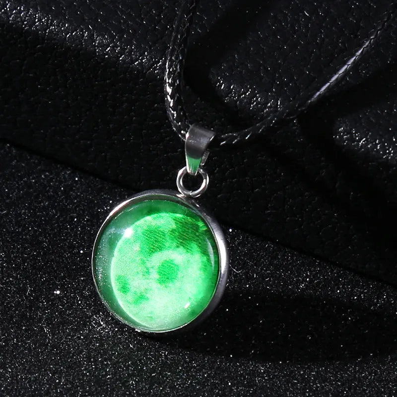 Luminous moon and constellation design pendant on an alloy necklace chain with extension.