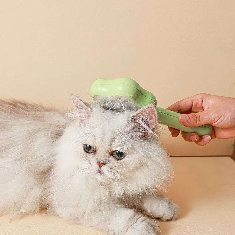 Self-cleaning cat comb magic wand with stainless steel needle teeth in green or yellow colour options