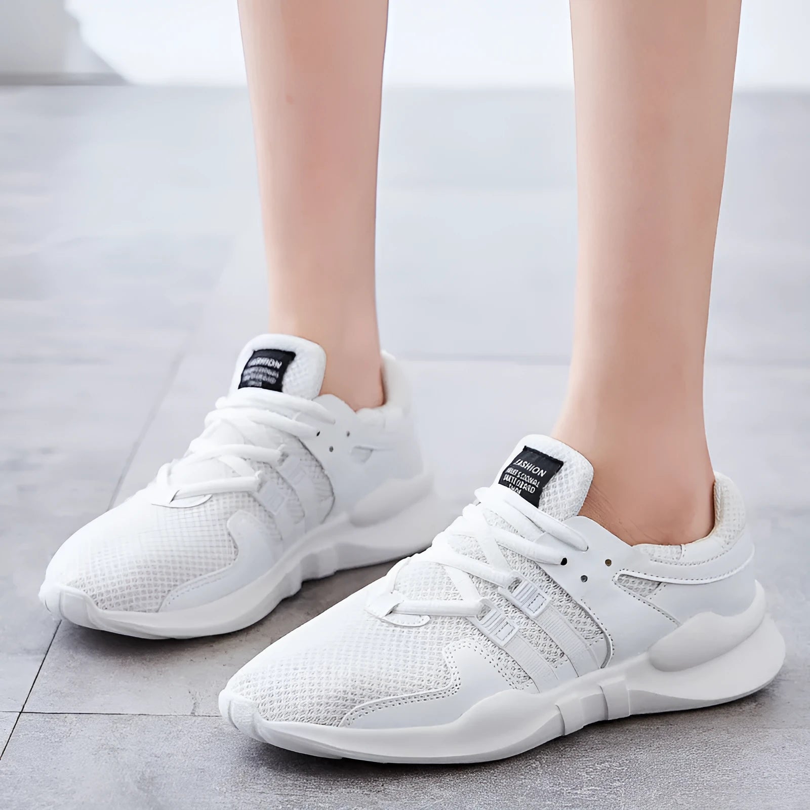 Breathable hollow-out mesh casual sneakers in black and white colour options with EVA sole