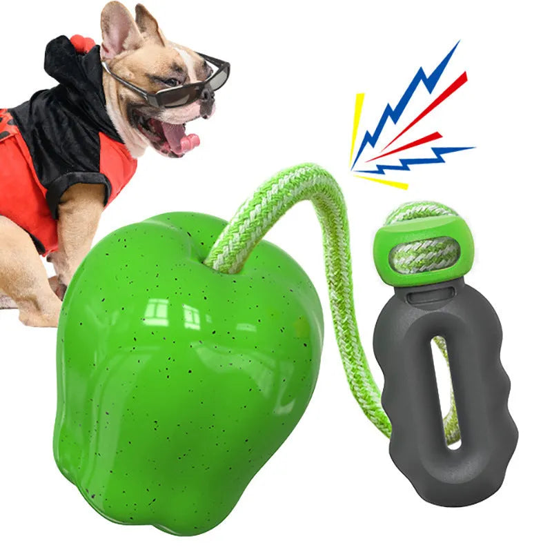 Green or red plastic apple-shaped dog dropping ball toy with hollow treat compartment
