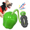 Green or red plastic apple-shaped dog dropping ball toy with hollow treat compartment