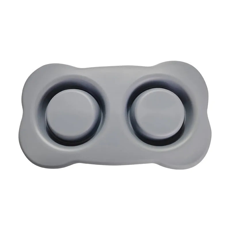 Large silicone dog bowl with stainless steel insert in choice of five colours on a plain background.