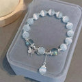 Women's glass butterfly drop-shape bracelet in a grey colourway with round details.