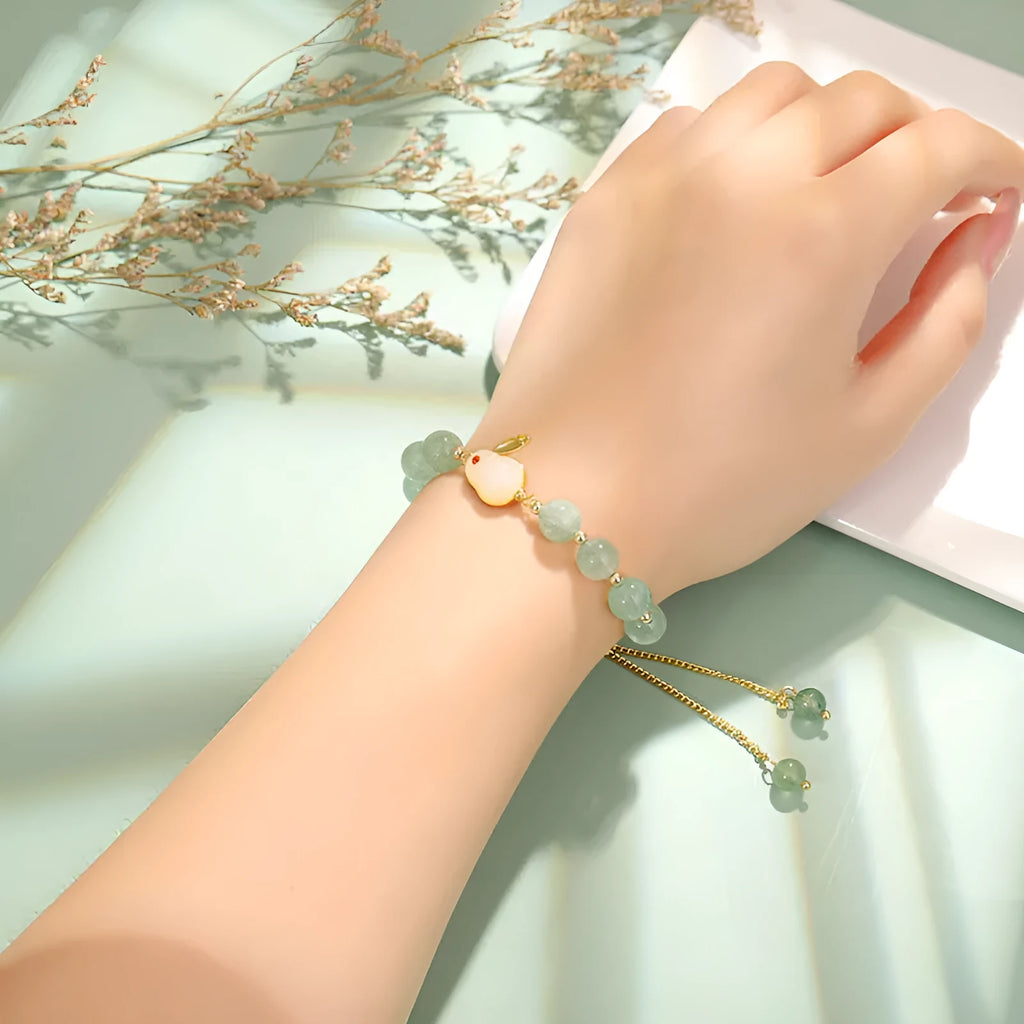 Women's rabbit charm bracelet with natural stone beads and gold accents
