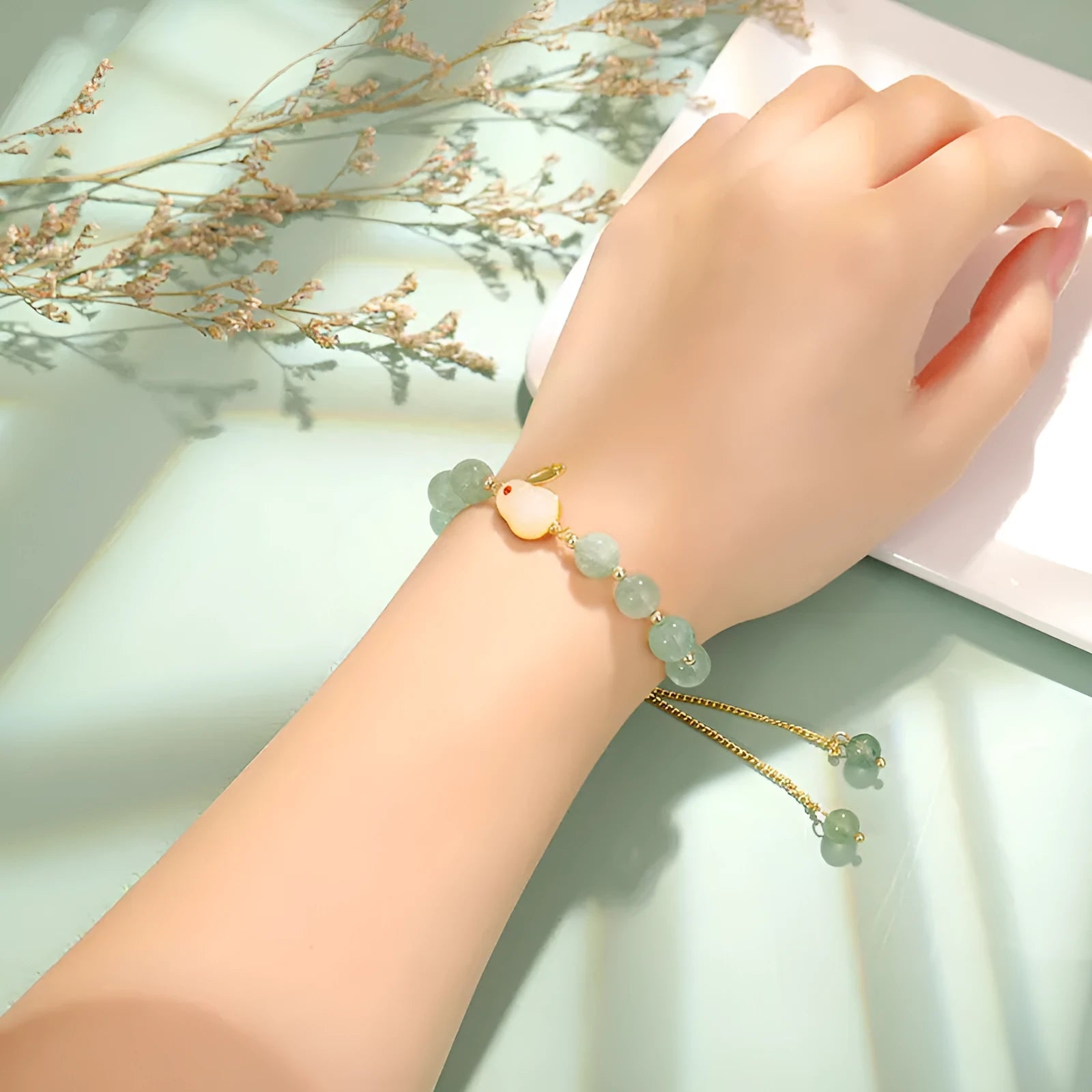 Women's rabbit charm bracelet with natural stone beads and gold accents