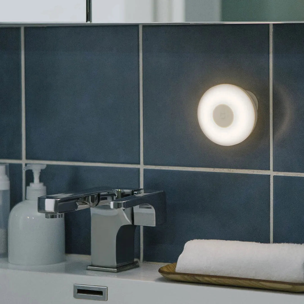 White modern bedside table lamp with Bluetooth and human body induction sensor.