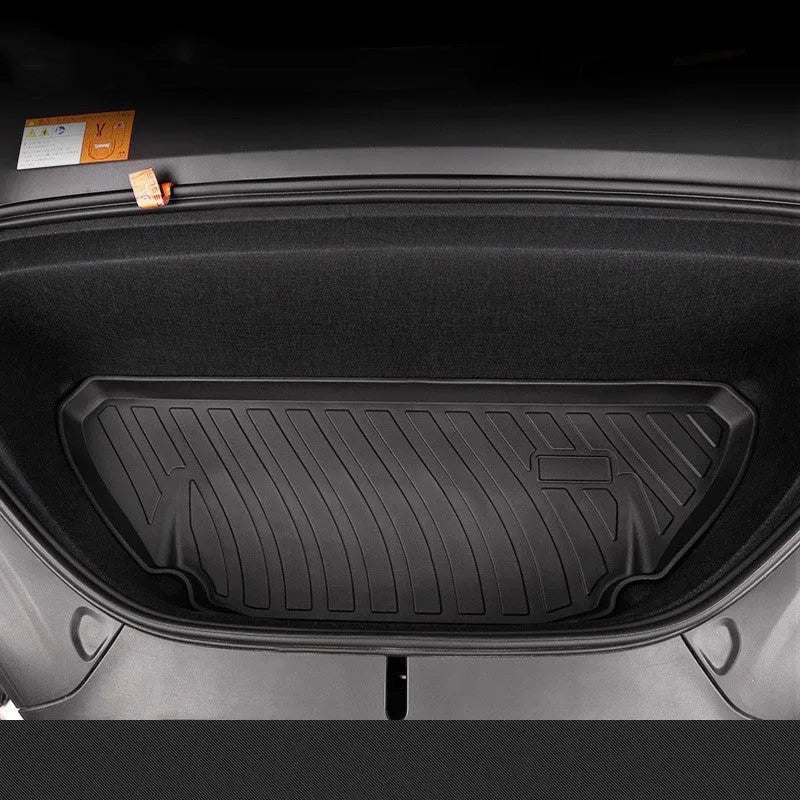 Custom rubber floor mats for Tesla cars with a textured TPE driver footrest section.