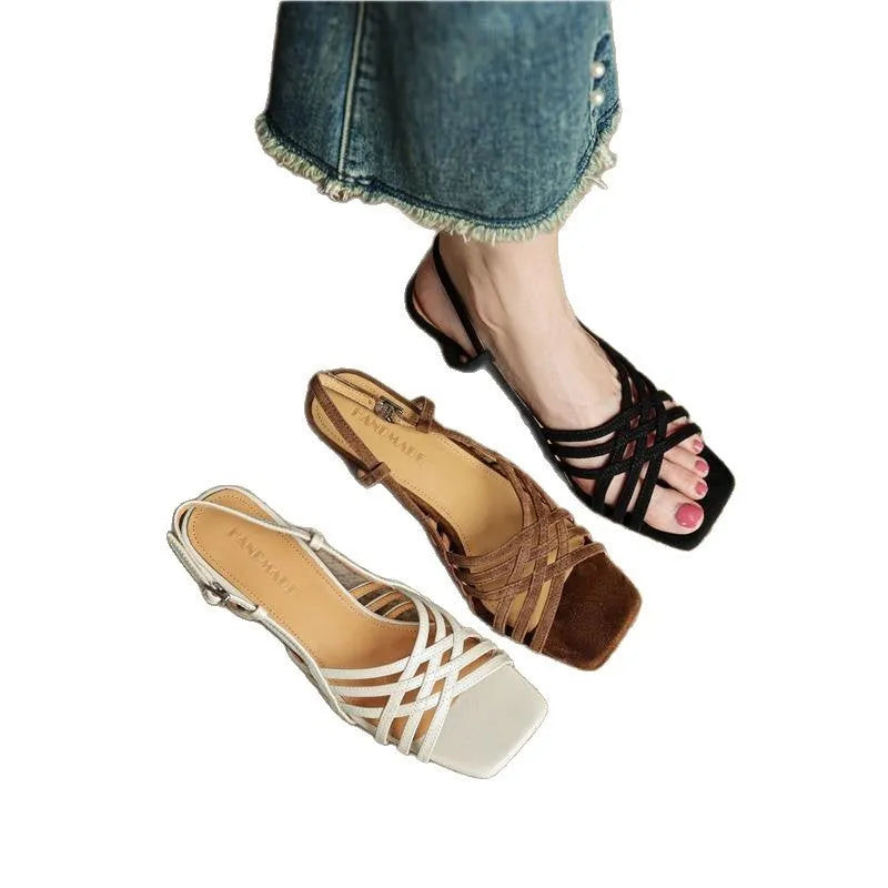 Women's light brown retro sandals with crossed straps, square toe, mid-heel, and ankle buckle on a white background.