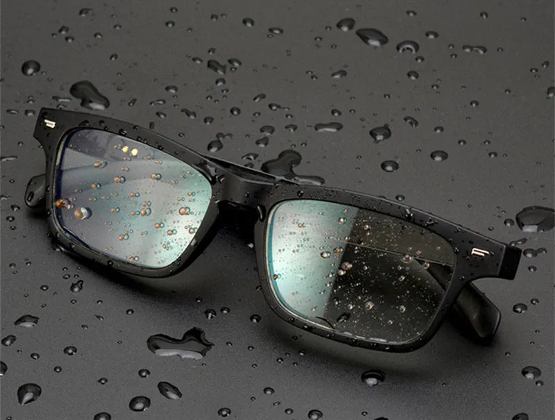 Smart Bluetooth audio glasses with semi-open ear speakers and dark polarised lenses.