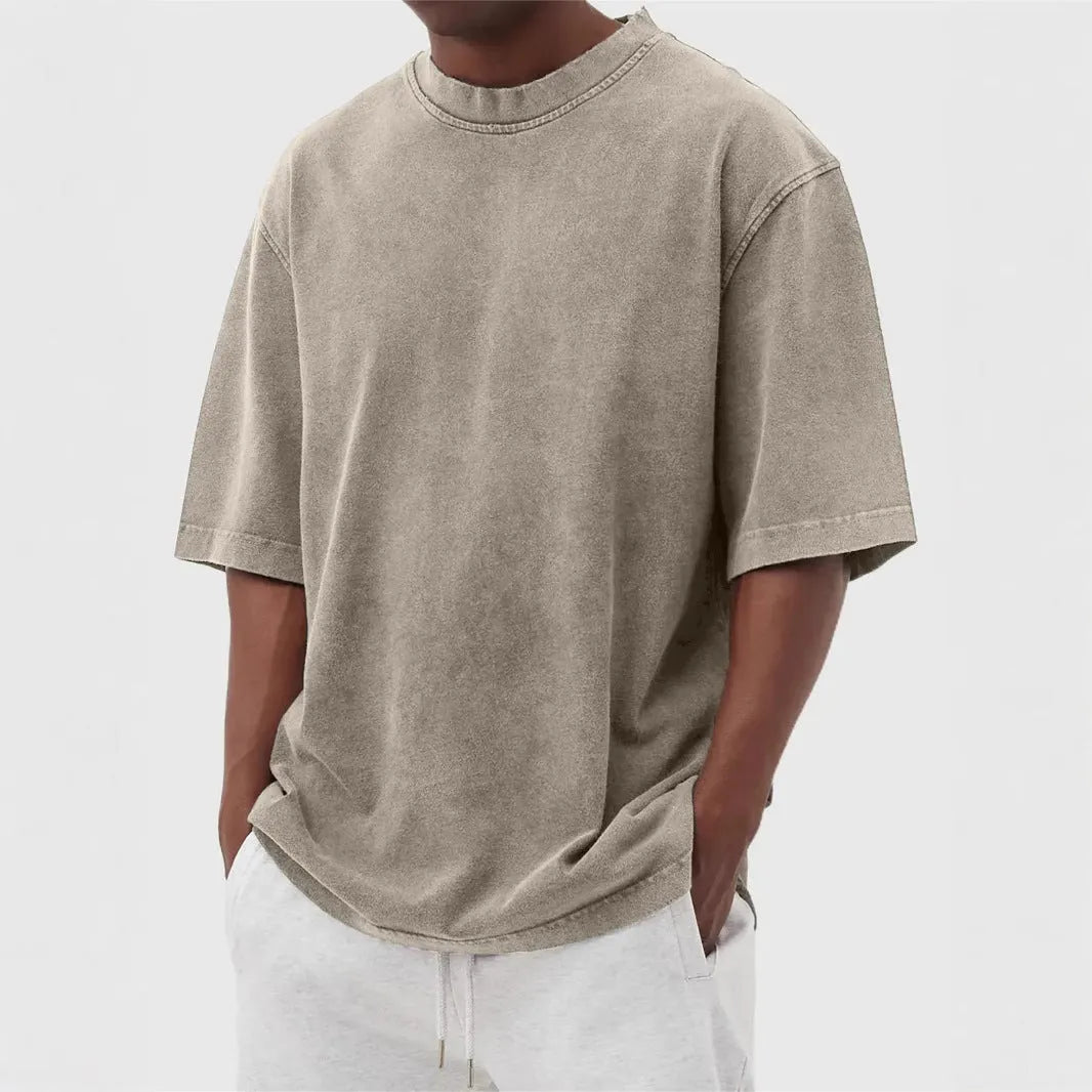 Men's loose fit distressed stone wash pullover t-shirt in solid colours like army green and blue.