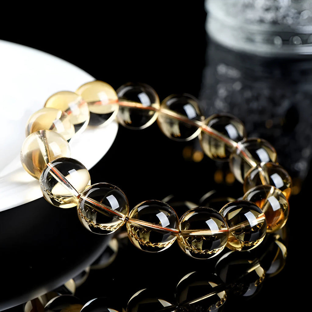 Natural citrine scattered bead bracelet showing polished yellow gemstone beads in an irregular design.