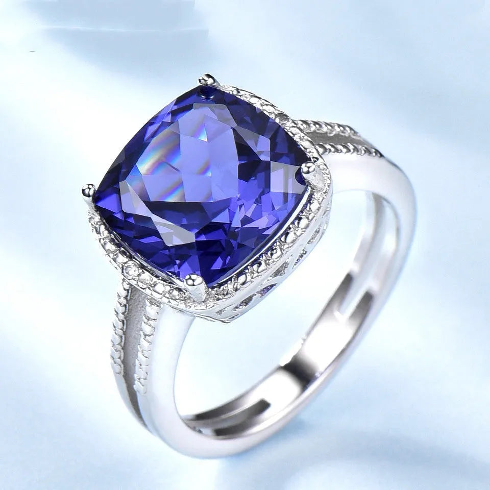 Blue tanzanite gemstone set in a sterling silver women's ring.