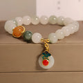 Women's ice jade bracelet with pearl accents and carved Xiangyun peace jade buckle