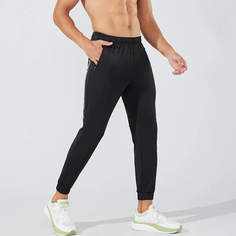 Men's black running trousers with mid waist and trouser length for exercise activities