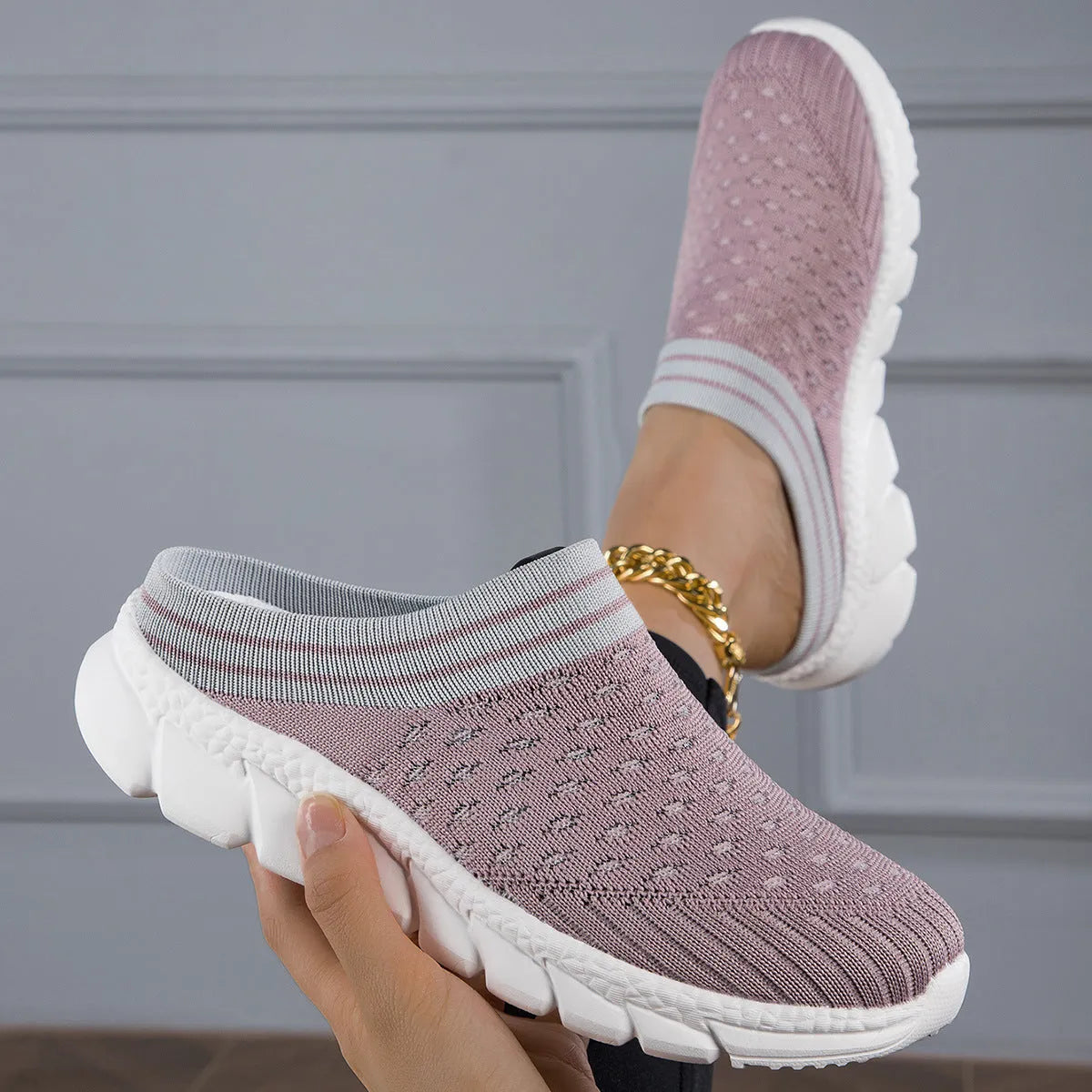 Women's black Flyknit semi slippers with hollowed-out sewing line detail and viscose sole