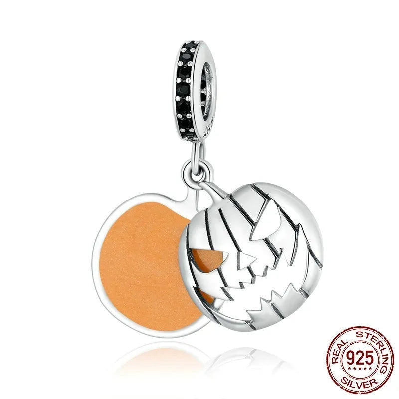 S925 sterling silver Halloween beaded bracelet with pumpkin and skull charms on a neutral background