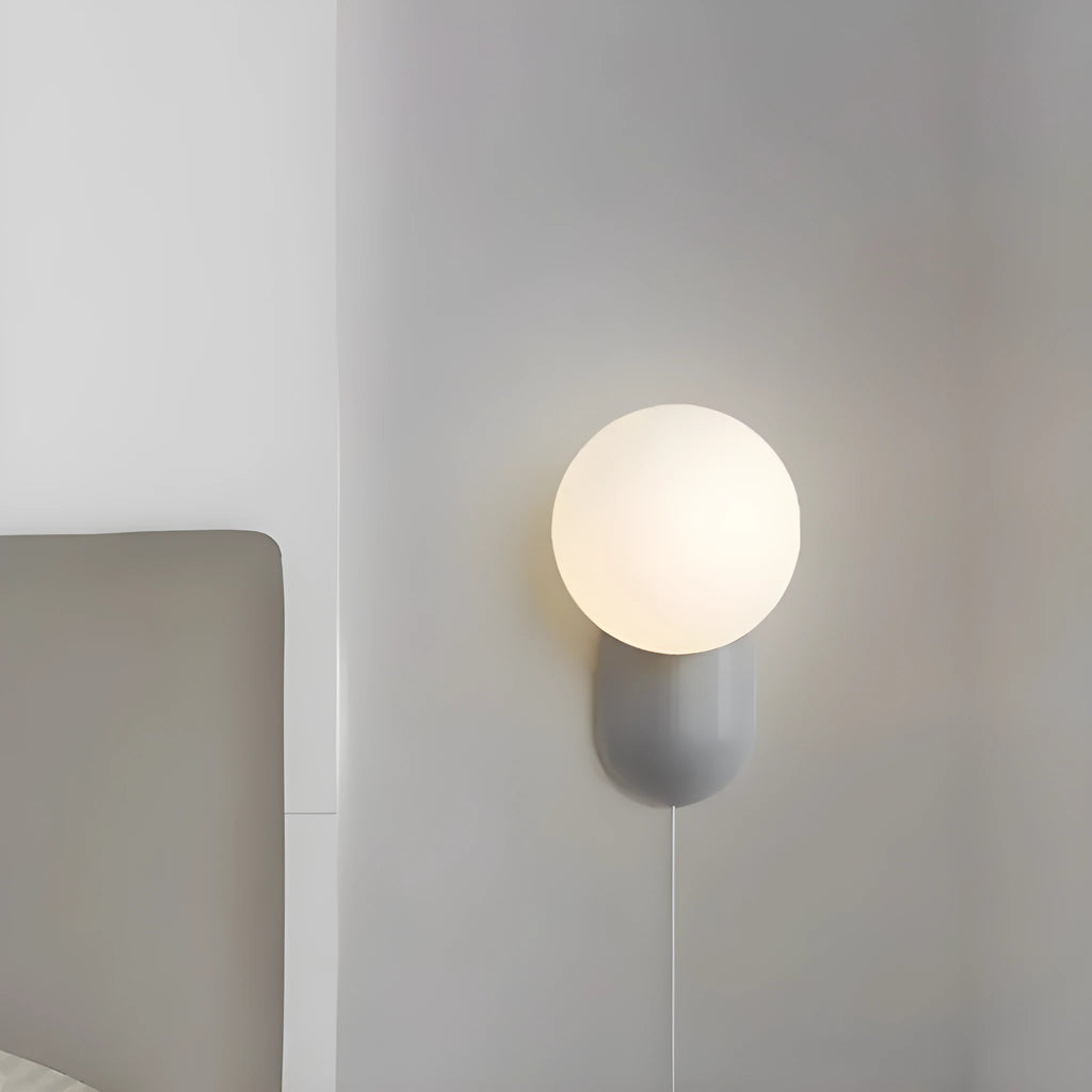 Nordic bedside wall lamp in black with acrylic shade and resin body