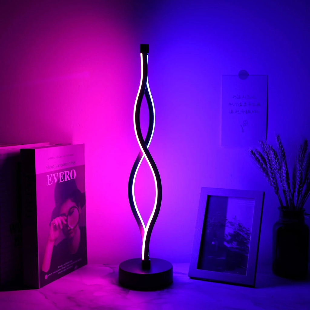 Black aluminium desk lamp with a touch dimming button for blue, pink, and warm white light.