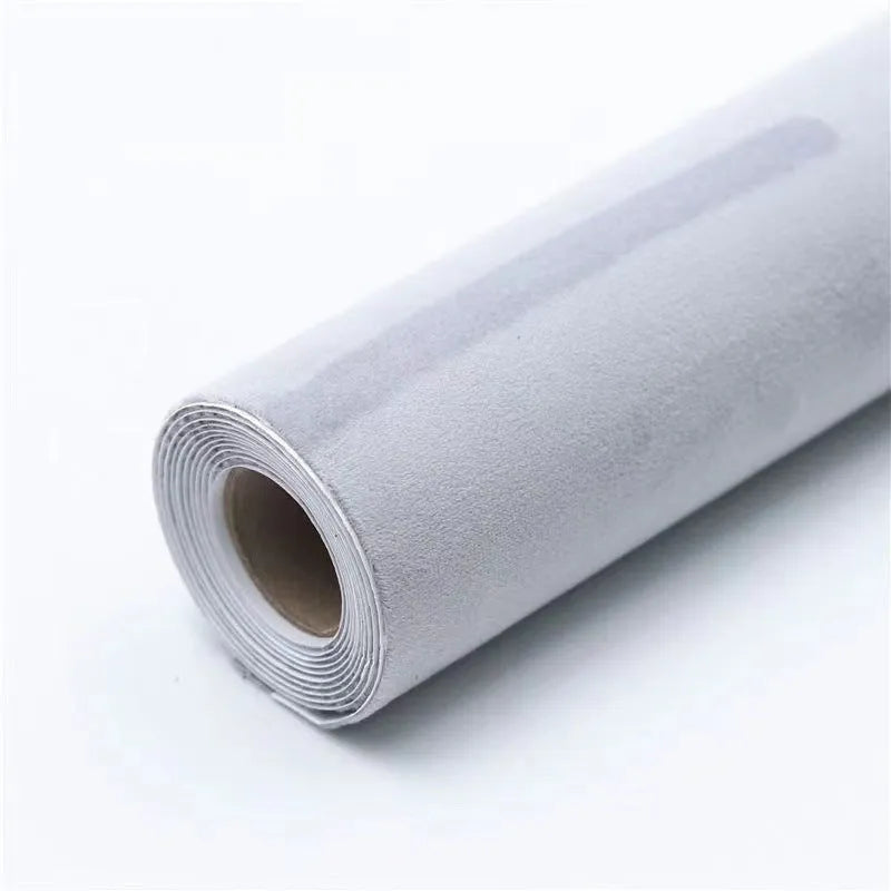 Self-adhesive leather suede sheet roll in multiple colour swatches showing black, brown, blue, and red.