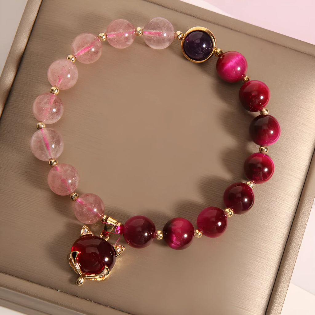 Women's strawberry crystal bracelet on elastic rope showing natural bead texture and uniform 18cm size