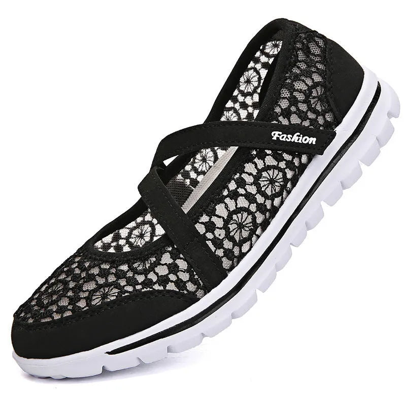 Women's beige lace-up casual flats with mesh upper and round toe on a light background.