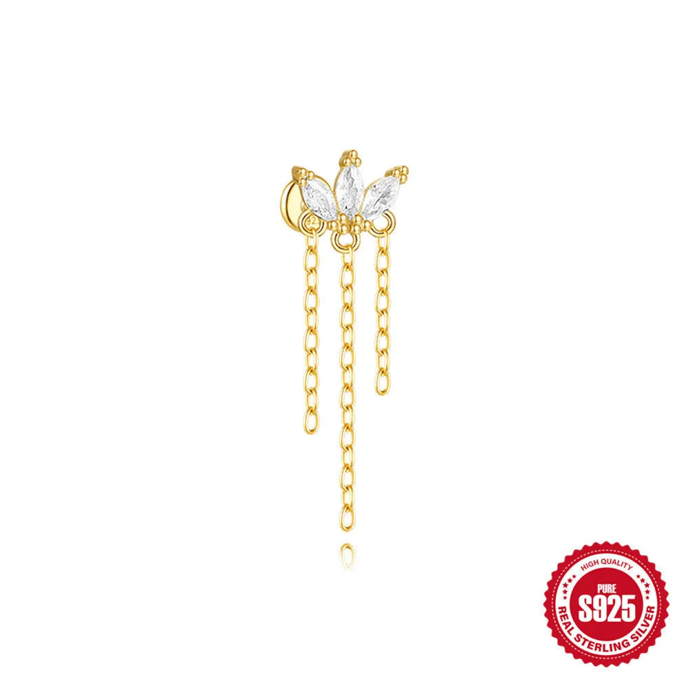 Geometric kite-shaped sterling silver earring with rhinestone head and gold chain tassel.