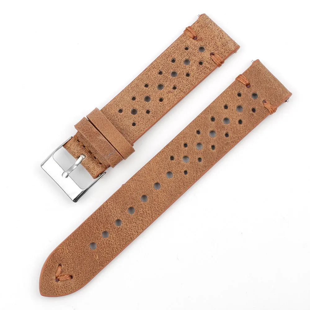 Handmade retro genuine leather watch band in brown with white stitching on a wooden surface