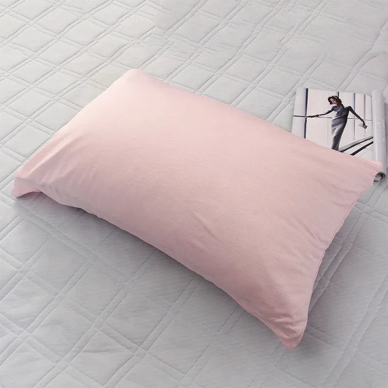 Blue Japanese cooling blanket with Q-Max fibres laid flat on a bed.