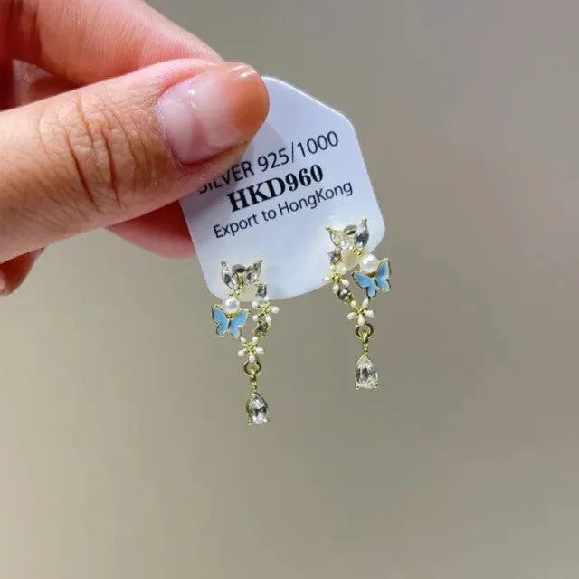 Geometric heart shape alloy earrings with rhinestone star tassel ear clip design for women