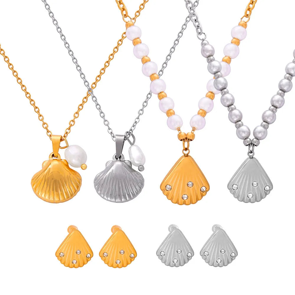Gold titanium steel women's necklace featuring a French vintage shell pendant with freshwater pearl beads on an O-chain.