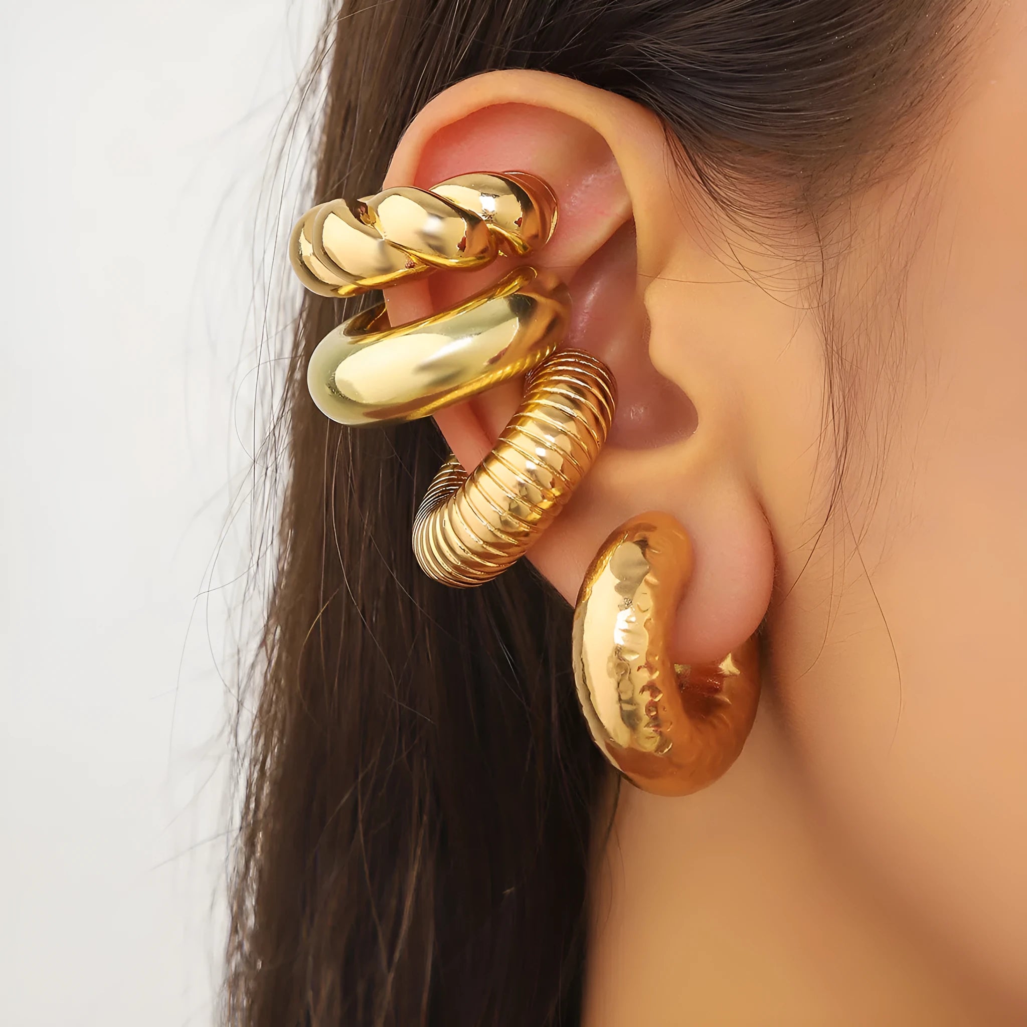 Set of four geometric non-pierced ear clips in gold and silver colours