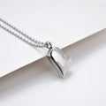 Curved peach heart stainless steel pendant necklace with silver electroplated finish and extension chain