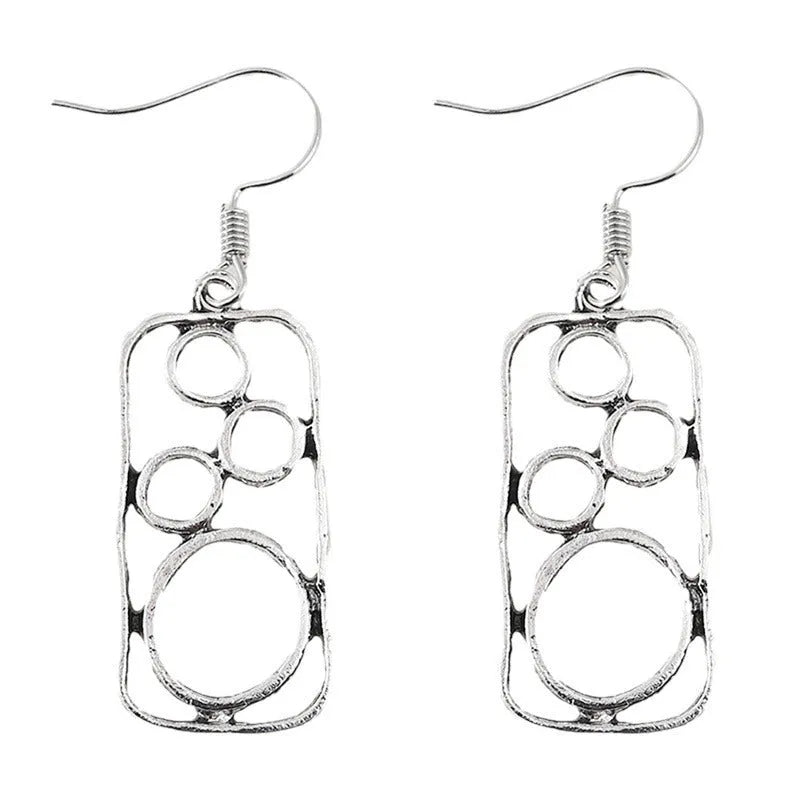 A pair of antique silver round ring earrings with a geometric irregular square design.