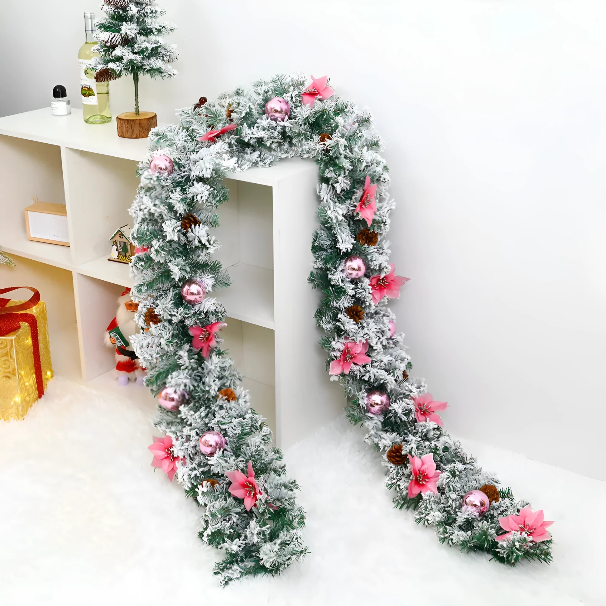 Christmas rattan garland decoration with flocked texture in five colour options displayed draped