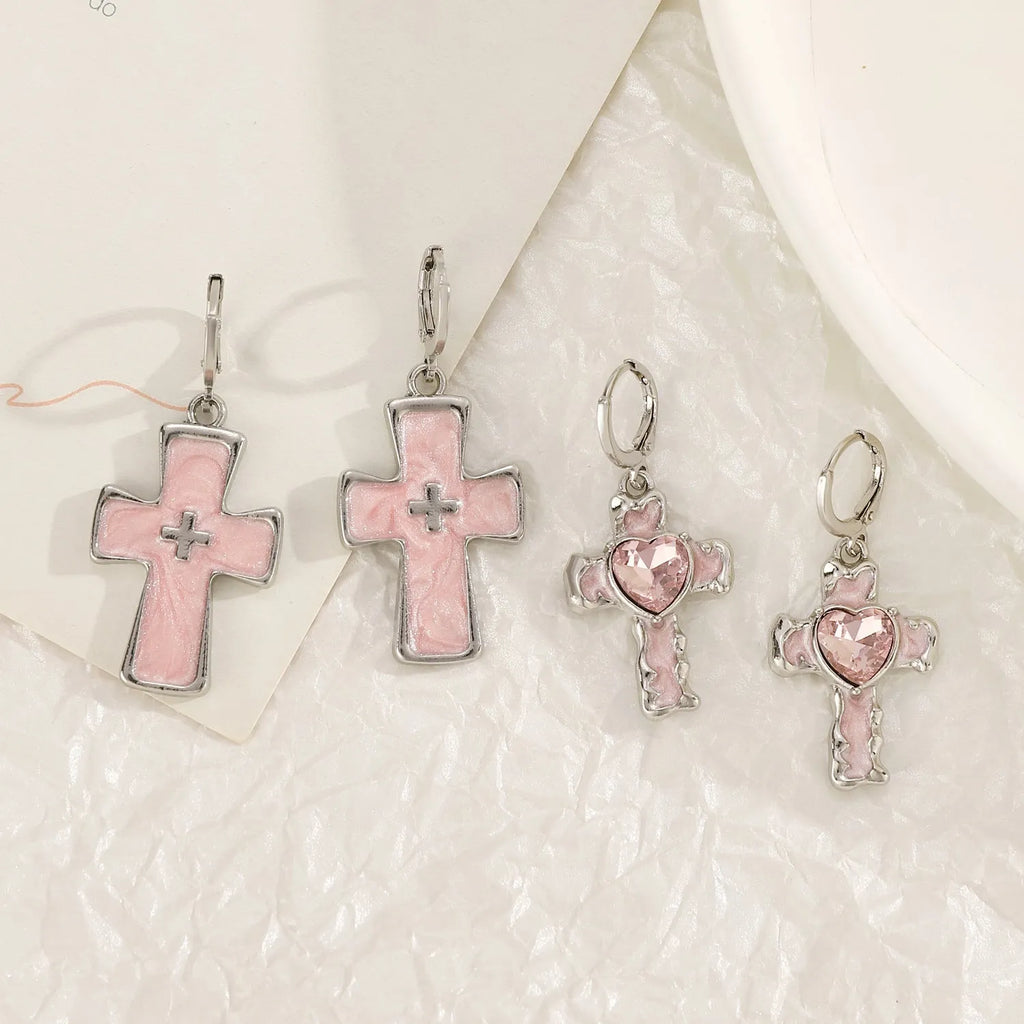 Women's alloy earrings with cross and heart designs in white and antique silver colour variants
